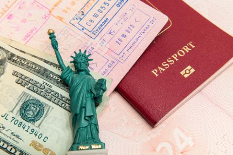 Passport visa and money. Image courtesy mariakraynova/shutterstock.com. Passport visa and money. Image courtesy mariakraynova/shutterstock.com.