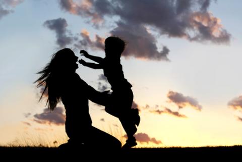 Young boy running into the arms of his loving mother for a hug. Courtesy Christin Gasner / Shutterstock