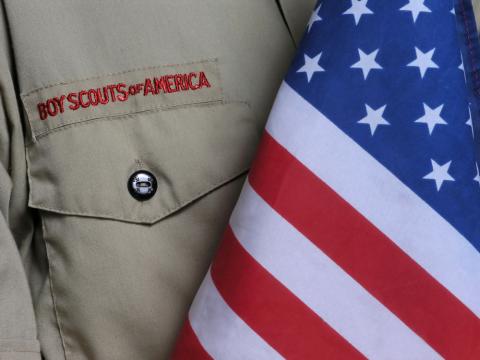 Boy Scouts of America uniform and flag. Photo courtesy RNS/Shutterstock.