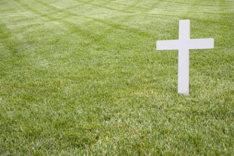 A cross near RFK's grave. Many perceived religion to be in decline in the 1960s. Photo via John Kropewnicki/shutterstock.com