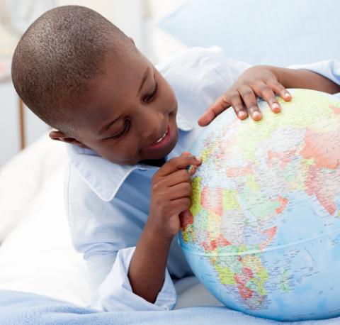 Small boy looking at his globe, wavebreakmedia / Shutterstock.com Small boy looking at his globe, wavebreakmedia / Shutterstock.com