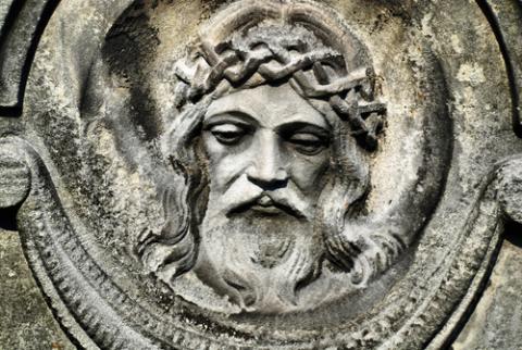 Face of Jesus from an old cemetery statue. Photo by Brasiliao/Shutterstock.com. Face of Jesus from an old cemetery statue. Photo by Brasiliao/Shutterstock.com.