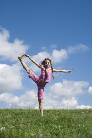 A girl standing in a yoga pose. Photo courtesy Kravchenko Marina/Shutterstock.com. Photo courtesy Kravchenko Marina/Shutterstock.com.