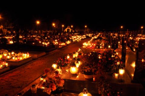 Candles illuminate a cemetery on All Saints' Day, wawritto / Shutterstock.com Candles illuminate a cemetery on All Saints' Day, wawritto / Shutterstock.com