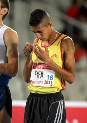 Muslim athlete Ilias Fifa of Morocco prays before of 5000m Event of Barcelona Athletics meeting at the Olympic Stadium in 2011.