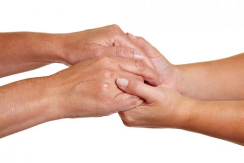 Hands expressing symbolic sympathies while holding each other. Robert Kneschke/Shutterstock Robert Kneschke/Shutterstock