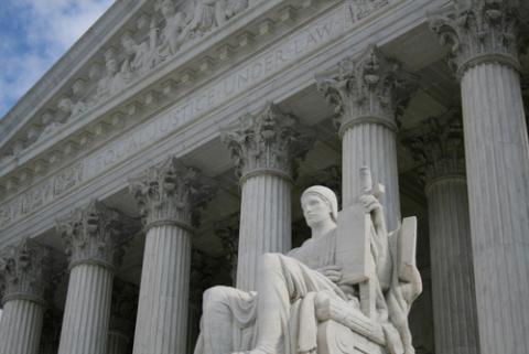 Statue ouside Supreme Court building in Washington, DC. Photo by Stephen Finn /Shutterstock. Photo by Stephen Finn /Shutterstock.