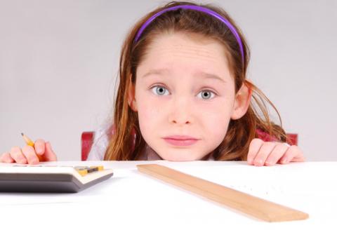 Girl working on math homework. Image by Cheryl Casey/Shutterstock.com. Girl working on math homework. Image by Cheryl Casey/Shutterstock.com.