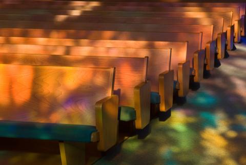 Empty church pews with heavenly light. Photo by Tony Marinella Photography/ Shutterstock.com. Empty church pews. Photo by Tony Marinella Photography/ Shutterstock.com.