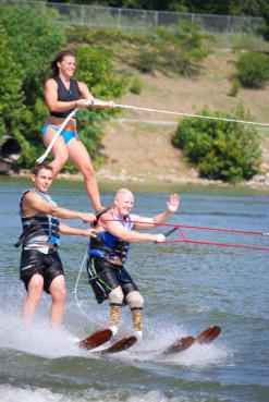 Mike Norrell and Woody Thornton ski in a pyramid with Gloria Walker at the top. Photo by Holly Thornton Photo by Holly Thornton