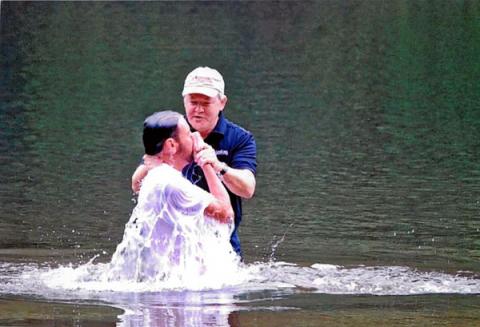The Rev. Frank Page baptizes Stephen Allmond in 2008, near Greenville, S.C. Photo via RNS/courtesy Rev. Frank Page.