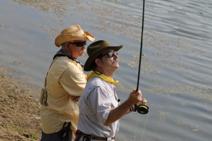 Mark Marmon (right) teaches fly fishing at Fishers of Men retreat. Via RNS/The Episcopal Diocese of Texas, Photo: Emily Krueger