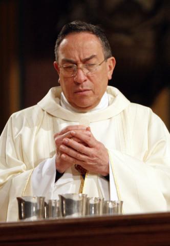 Honduran Cardinal Oscar Rodriguez Maradiaga prays at St. Paul the Apostle Church in New York. RNS photo by Gregory A. Shemitz.