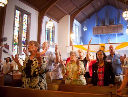 Congregants pray during Catholic mass at St. Therese Little Flower parish in Kansas City, Mo. RNS photo by Sally Morrow. RNS photo by Sally Morrow.