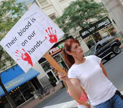 Victoria Ann Thorpe protests against the death penalty outside of a Spokane mall. Victoria Ann Thorpe protests against the death penalty outside of a Spokane mall