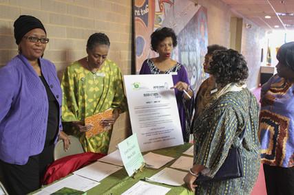 Rosalyn Priester, Pat Owens and Adrienne Wynn at an Earth Day display. Photo courtesy Trinity UCC Photography Ministry. Via RNS