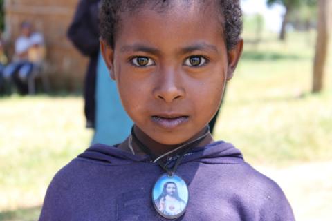 Girl at a U.S.-funded project Empowering New Generations to Improve Nutrition and Economic Opportunities. By Cathleen Falsani By Cathleen Falsani