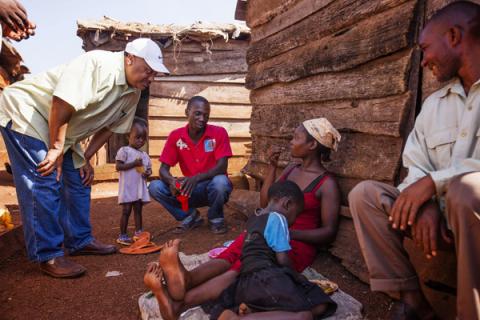 Fred Luter, left, visits with villagers in Uganda on May 28. Photo courtesy International Mission Board Photo courtesy International Mission Board