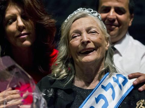 Shoshana Colmer smiles after winning the ‘Miss Holocaust Survivor Beauty Contest’ in Haifa. Photo via RNS/EPA/Jim Hollander Shoshana Colmer smiles after winning the ‘Miss Holocaust Survivor Beauty Contest
