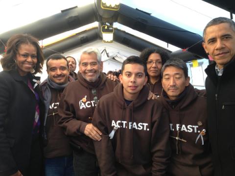President Obama and First Lady Michelle Obama pose for a photo with the fasters. Photo via RNS, courtesy Fast for Families
