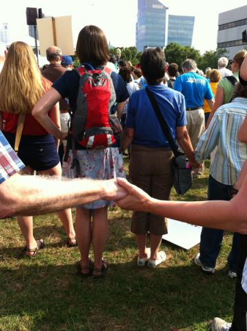 Participants hold hands at the Moral Monday demonstration last Monday. Photo Coutesy RNS/Yonat Shimron. Photo Coutesy RNS/Yonat Shimron.