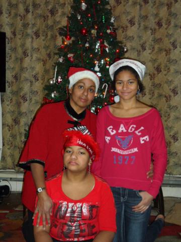 Zeyna Ahmed, with daughters Nadyah Abdul-Majid, 13, Hadyah Abdul-Majid, 11, during Christmas. Photo courtesy Zeyna Ahmed Photo courtesy Zeyna Ahmed