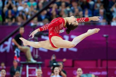 Aly Raisman of Needham, Mass., won a gold medal on Tuesday in the women’s all-around gymnastics.