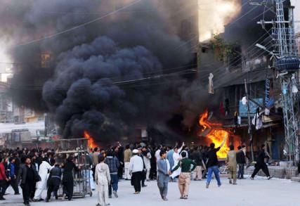 Shiites torch a procession mourning deaths of Prophet Mohammad’s grandchildren. Photo by Naveed Ahmad. Via RNS.