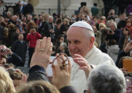 Pope Francis greets a crowd on his way to a meeting with cardinals at the Vatican on Friday (Feb. 21). RNS photo by David Gibson