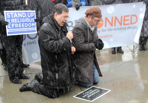 Rev. Frank Pavone of Priests for Life, left, leads a prayer in front of the Supreme Court. Photo via Adelle M. Banks / RNS Photo via Adelle M. Banks / RNS