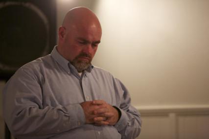 Pastor Jamie Coots prays during a service in Middlesboro, Ky. Photo courtesy National Geographic Channel / RNS
