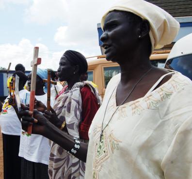 Women standing outside the All Saints Cathedral in Sudan. Religion News Service photo by Fredrick Nzwili.