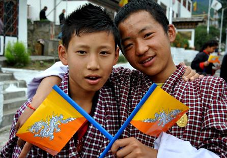 Two Bhatanese students carry the national flag. RNS photo by Vishal Arora RNS photo by Vishal Arora