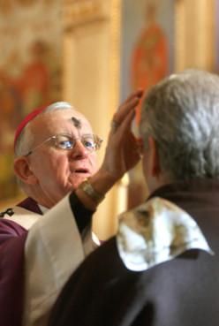 Rev. John G. Vlasny, archbishop of Portland, performs the Ash Wednesday ceremony. Photo by Michael Lloyd. Via RNS
