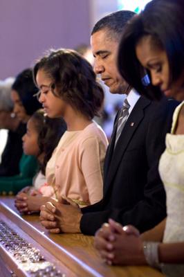 President Obama and his family pray during Easter services. RNS file photo courtesy Pete Souza/The White House. RNS file photo courtesy Pete Souza/The White House