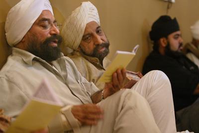 as Singh of New York City, left, and Gurbakht Singh Gulati of Toronto, right, attend worship. Li-Hua Lan/The Post- Standard Religion News Service photo by Li-Hua Lan/The Post- Standard in Syracuse, N.Y.