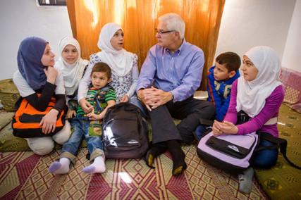 World Vision’s U.S. President Rich Stearns, center, visits Syrian refugees in Jordan. Photo by Jon Warren, courtesy World Vision