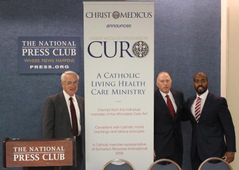 David E. Wilson, Michael J. O'Dea, and Louis Brown Jr. introduce Christ Medicus Foundation CURO. Photo via Sally Morrow/RNS.