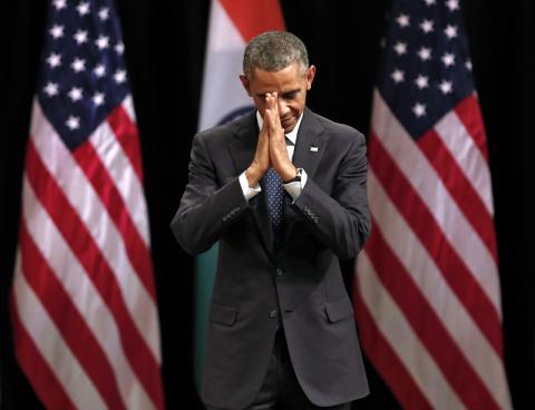 U.S. President Barack Obama folds his hands in a traditional Indian greeting. Photo via REUTERS / Ahmad Masood / RNS Photo via REUTERS / Ahmad Masood / RNS