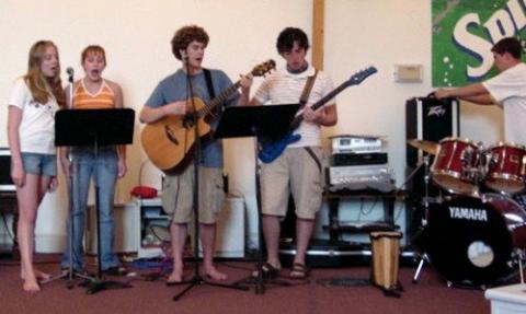 Tim King (middle on guitar with the 'fro) with his youth group's worship band. Photo courtesy Tim King Tim King with his youth group's worship band. Photo courtesy Tim King