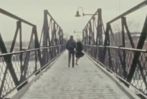 Polley's parents dance along a snowy bridge. Screenshot from Stories We Tell.