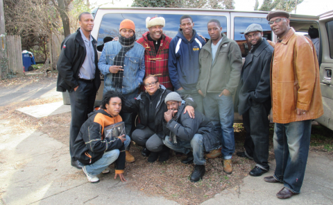 Tyrone Parker, top row in red, with Alliance of Concerned Men participants.