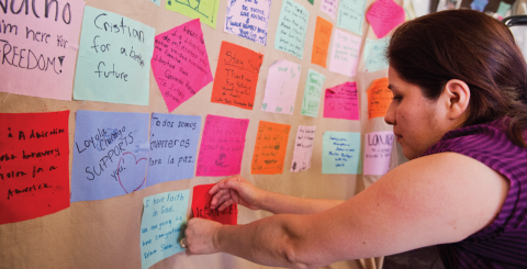 Miriam Perlacio assembles a prayer quilt in the Fast for Families tent on the National Mall. Photo by Tom Williams/CQ Roll Call