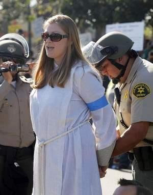 Stephanie Kimec joins Walmart workers and supporters at a Black Friday protest calling for fair wages.