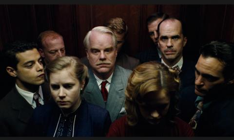 Philip Seymour Hoffman, center, in The Master.
