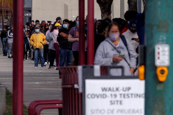 People wait outside a community center as long lines continue for individuals trying to be tested for COVID-19 during the outbreak of the coronavirus disease in San Diego, Calif., Jan. 10, 2022. 