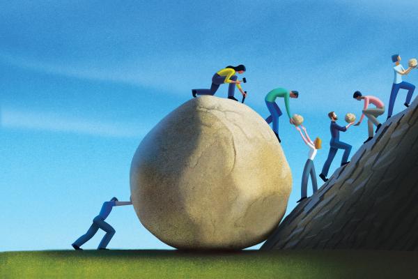 Humans working together to take apart a giant boulder into pieces to carry it up a mountain.