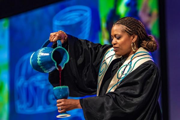 female pastor preaching