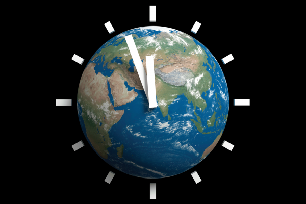 There is an image of a globe with a clock superimposed on top, with the minute hand almost striking midnight. 