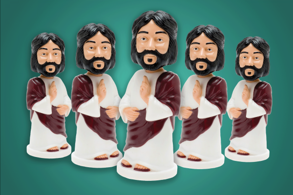 The image shows a group of plastic bobble-head Jesuses